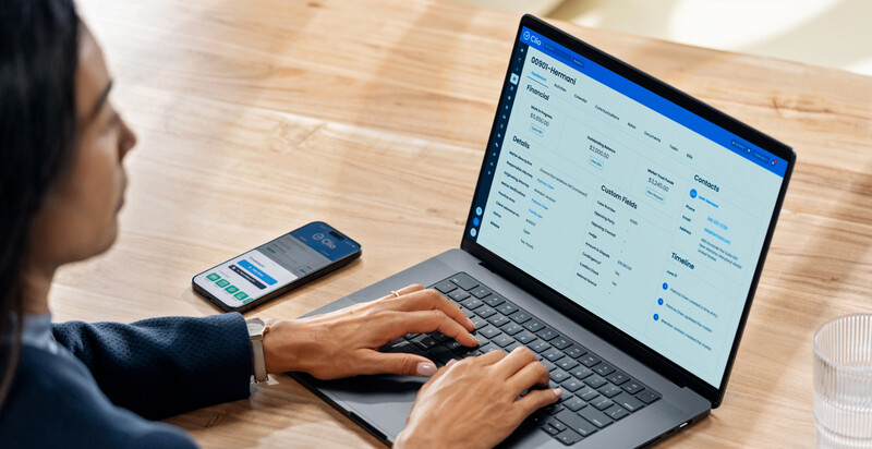 Lady typing on a laptop keyboard